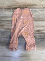 Flat lay of Kyte Baby sleeveless bamboo zip romper in peach showing front zipper and sunrise print on light wood background