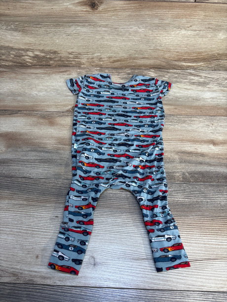 Gray baby romper with colorful race car print, short sleeves, laid flat on wood floor