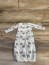 Flat lay of newborn white Simple Joys gown with gray dinosaur print, long sleeves and elastic bottom on wood floor