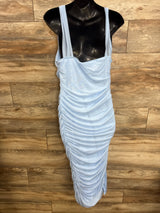 Light blue ruched maternity dress on mannequin, perfect for pregnancy fashion