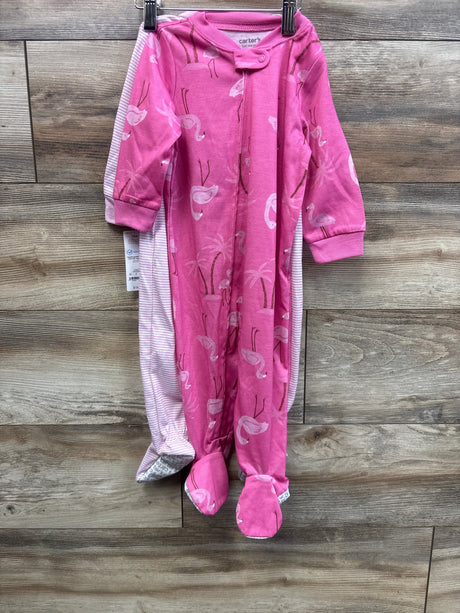 Front view of 2-pack baby footed sleepers, pink flamingo print and pink-white stripe, size 12M, hanging on wood wall