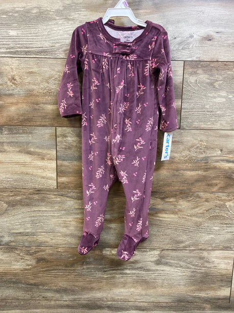Front view of Carter’s purple blanket sleeper and headband set with pink floral print and covered feet on wood
