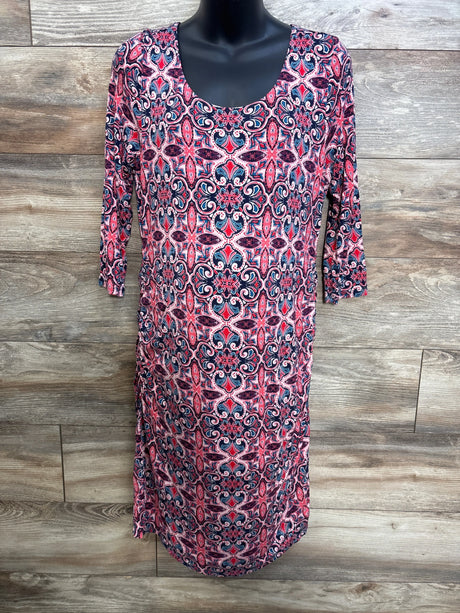 Front view of Jessica Simpson pink maternity dress XL with scoop neck, 3/4 sleeves, and navy-pink medallion print on wood backdrop