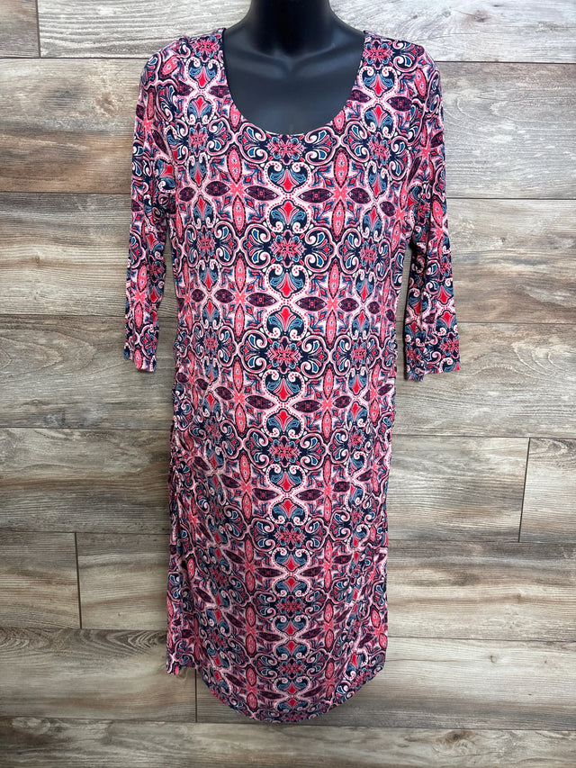 Front view of Jessica Simpson pink maternity dress XL with scoop neck, 3/4 sleeves, and navy-pink medallion print on wood backdrop