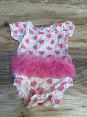 Pink strawberry print baby girl bodysuit with ruffled tutu on wood background