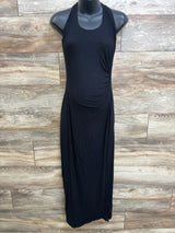 Front view of black maternity tank maxi dress showing side ruching over the belly on a mannequin against a wood plank background
