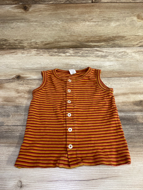 Top-down view of Kate Quinn orange striped button-up tank top in size 3T with front buttons on wood-grain background