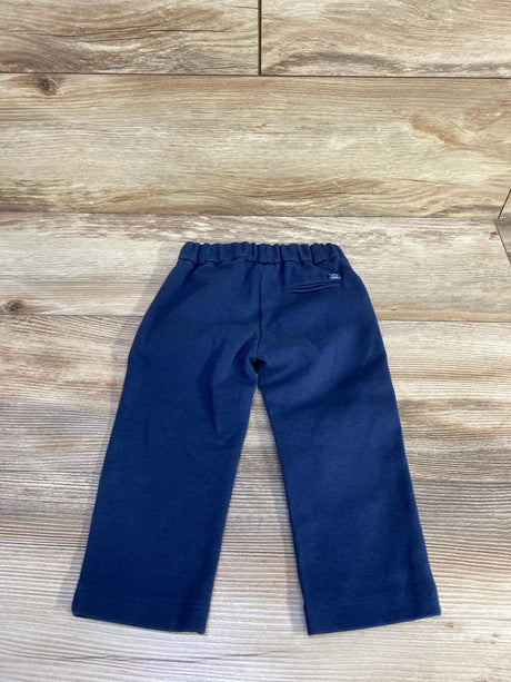 Back view of navy toddler dress pants size 12 month showing elastic waistband and faux back pocket on wood floor background