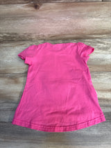 Bright pink toddler t-shirt, short sleeve, laid flat on wood floor. Kids clothing resale.