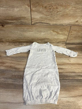 Flat lay of grey Simple Joys newborn gown showing long sleeves, LOVED chest embroidery, and elasticized bottom on wood floor