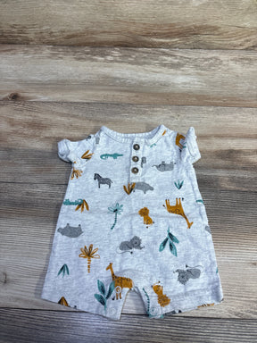 Flat lay of newborn grey Henley shortie romper with three wooden buttons, animal print, and snap crotch on wood background