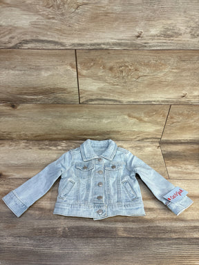 Front view of Cat & Jack light blue denim jacket (12M) showing buttons, chest pockets and faded wash on wood background