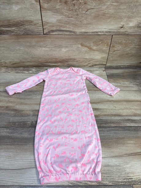 Front view of pink Simple Joys sleep sack, size 0 to 3 months, with long sleeves, animal print, and elasticized hem on wood
