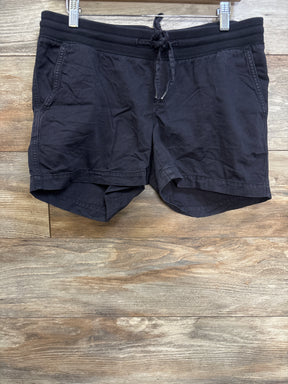 Front view of Gap maternity drawstring shorts in black with elastic waistband, drawstring, and front pockets on wood background