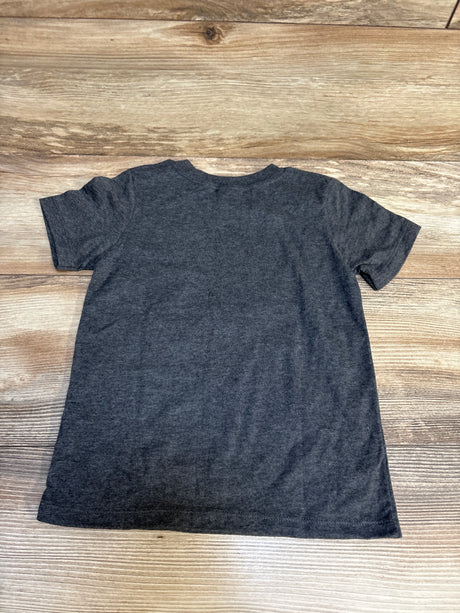Charcoal gray short sleeve kids t-shirt laid flat on wood background