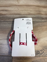Top view of Gymboree headband and bow set with red-and-white gingham pattern on white cardboard backing