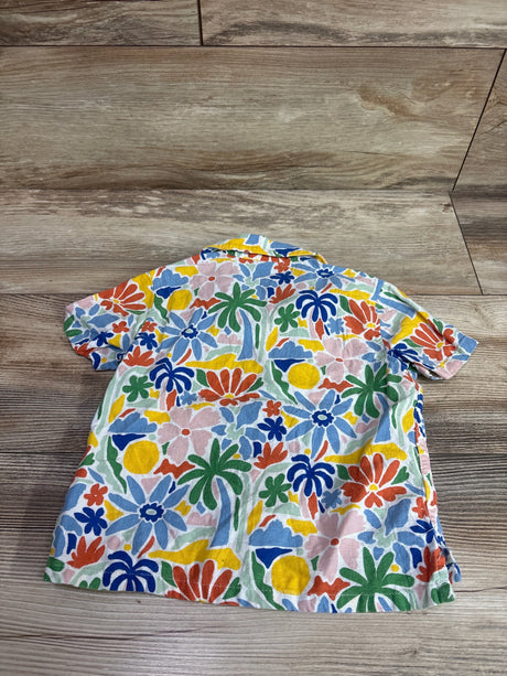 Back view of Old Navy linen blend button-up shirt in size 2T showcasing colorful floral print on a wood floor