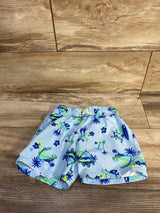 Front view of blue 4T Cat and Jack swim trunks with neon green tropical print and elastic drawstring on wood background