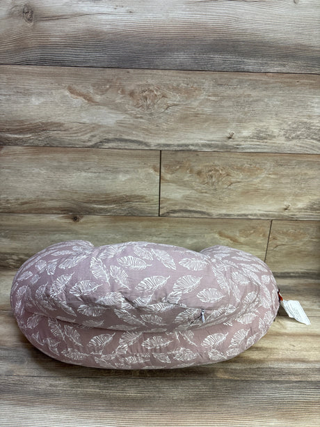 Front view of Momcozy Original Adjustable Nursing Pillow in Pink showcasing a white leaf pattern with a wood plank background