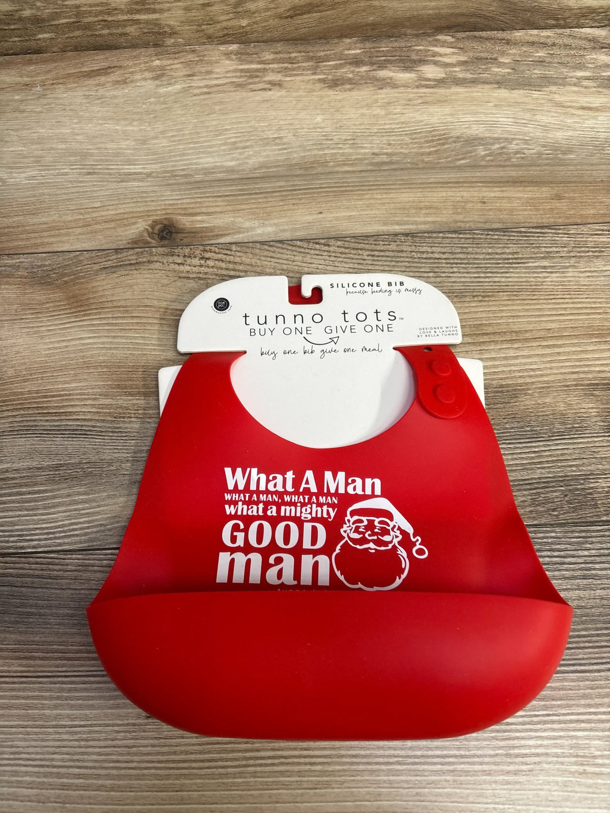 Red silicone baby bib with Santa design and 'What A Man' text, perfect for holiday feeding messes.