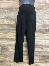 Front view of Feathers maternity drawstring joggers in black showing high-rise belly panel and relaxed tapered legs against wood background