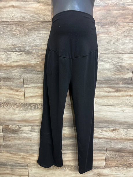 Front view of Feathers maternity drawstring joggers in black showing high-rise belly panel and relaxed tapered legs against wood background