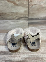 Front view of Child of Mine slip-on clogs showcasing beige boucle upper and elastic heel straps with wood floor background