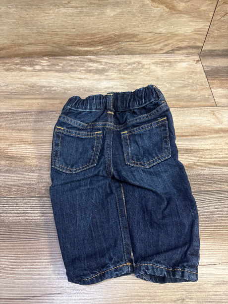 Back view of Baby Gap Plaid Lined My First Straight Jeans showcasing elastic waist and back pockets on a wood floor