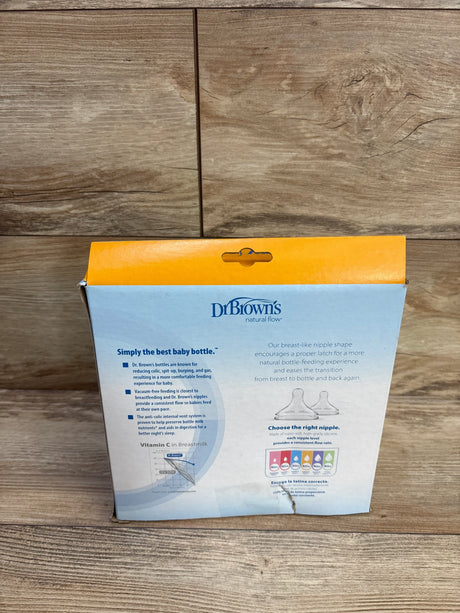 Back of Dr Browns 3-pack wide-neck 9 oz bottle box showing Level 1 slow-flow nipple and anti-colic info on wood background