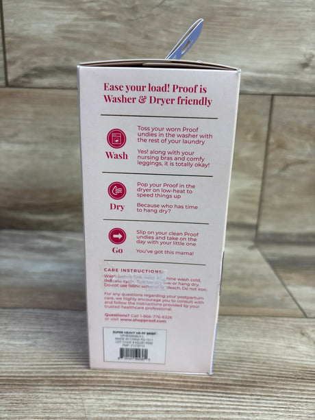 Back view of NEW Proof Reusable Postpartum Underwear High Rise Brief sz Large packaging showcasing washer and dryer care instructions on pink box on wood plank floor