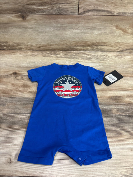 Blue Converse Chuck Taylor All Star shortie romper for infants, size 6m, on a wood background.