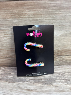 Rainbow candy cane hair clips for kids, colorful holiday accessories on black card