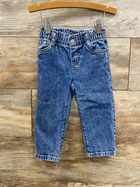 Blue denim toddler jeans with elastic waistband on wooden hanger, kids clothing resale