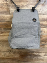 Overhead view of Maliton hanging diaper caddy organizer in grey showing closed front flap, hanging straps with clips, and mesh side pockets on wood floor