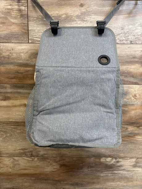 Overhead view of Maliton hanging diaper caddy organizer in grey showing closed front flap, hanging straps with clips, and mesh side pockets on wood floor