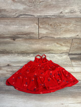 Flat lay of red Cat and Jack tank dress for 18 months, showing cross-back straps, tiered ruffle skirt and small star print on wood floor