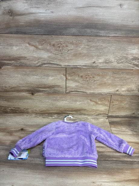 Purple fuzzy kids jacket with striped cuffs and hem, displayed on wooden background