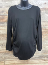 Front view of black Ekouaer maternity long-sleeve shirt with side ruching, on mannequin against wood background