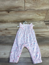 Front view of pink Bluey floral jumpsuit size 0-3m with ruffle cap sleeves and flower and star print on wood background