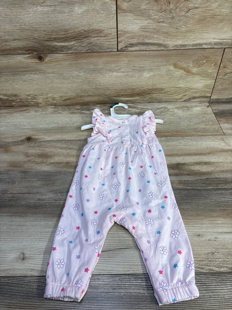 Front view of pink Bluey floral jumpsuit size 0-3m with ruffle cap sleeves and flower and star print on wood background