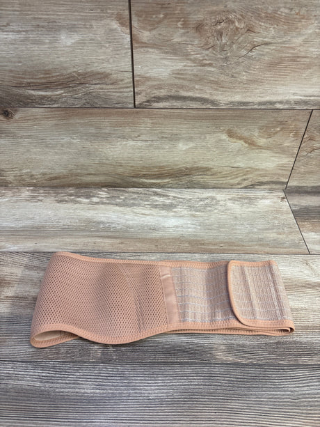 Front view of beige maternity back support band showcasing breathable mesh and hook-and-loop closure on a wood-look floor