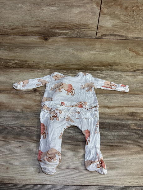 Flat lay Milkbarn bamboo elephant-print ruffle footie with ruffle waist on wood plank background