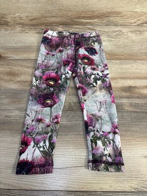 Flat lay of Molo Floral Stefanie leggings size 2T showcasing all-over pink and purple floral print and elastic waistband on wood background