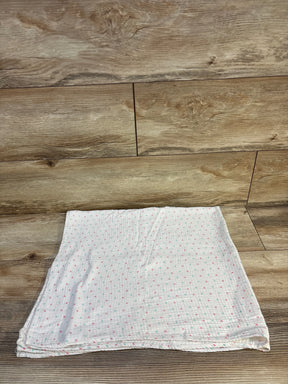 Soft baby muslin blanket with pink and mint polka dots on wood floor, ideal for newborns and toddlers