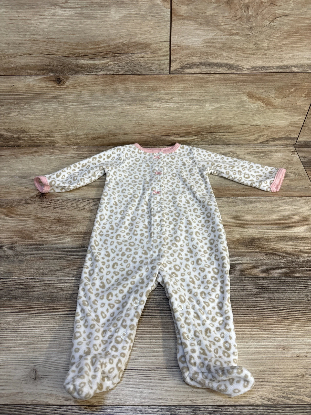 Leopard print baby onesie with pink trim, soft fleece footed sleeper for infants