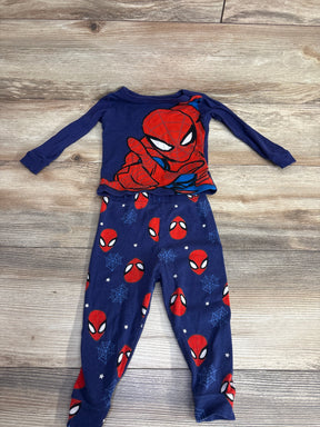 Children's two-piece blue Spider-Man pajamas with long sleeves and web designs on pants on wooden floor