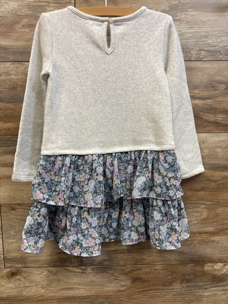Front view of Oshkosh grey sweatshirt dress size 5T with long sleeves and a floral tiered skirt on a wooden hanger