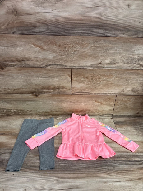 Front view of Puma two piece pink track jacket and gray leggings set showcasing striped sleeve panels and peplum hem