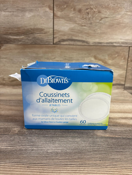 Box of Me n Mommy To Be disposable breast pads, 60 count, on a wooden surface.