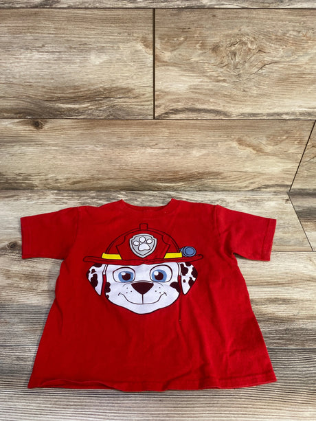 Flat lay of red PAW Patrol Marshall 4T toddler tee showing large Marshall face graphic and short sleeves on wood background